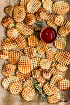 homemade crackers with rosemary sprigs and ketchup