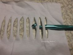 several different sized toothbrushes sitting on top of a piece of cloth