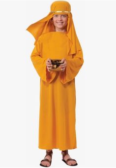 a young boy dressed in an orange monk costume and holding a small bowl with food on it