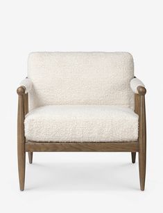 a white chair sitting on top of a wooden frame