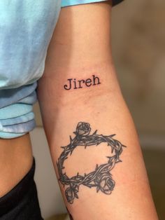 two people with tattoos on their arms that say jireh and the other one has a crown