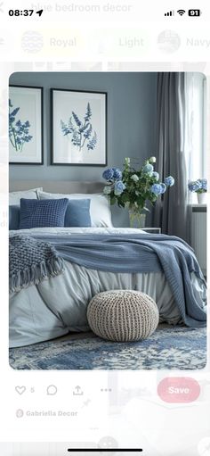 a bed room with a neatly made bed and pictures on the wall