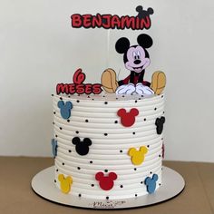 a mickey mouse birthday cake on a table