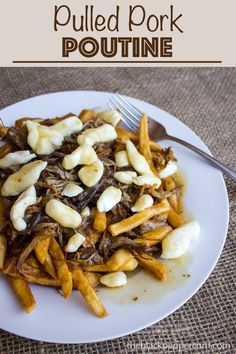 a white plate topped with french fries and sliced bananas