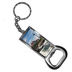 a metal key chain with a photo on it