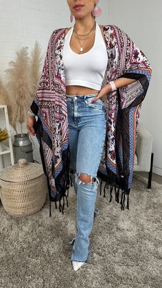 The Bohemian Tassel kimono boasts a striking diamond floral pattern and delicate tassels, creating an elegant and distinctive style. Spring Kimono With Tassel Ties, Casual Spring Kimono With Tassels, Beach Kimono With Tassels One Size, Bohemian Festival Kimono With Tassel Ties, One Size Tassel Kimono For Vacation, Vacation Kimono With Tassels One Size, One Size Vacation Kimono With Tassels, Spring Open Front Kimono With Tassels, Casual Spring Kaftan With Tassels