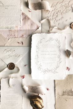 an assortment of paper with writing on them and some gold foil in the middle, along with other papers