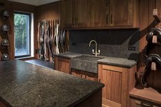 a kitchen with wooden cabinets and granite counter tops