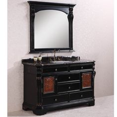 a bathroom vanity with a mirror above it