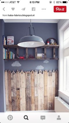 an empty room with some shelves on the wall