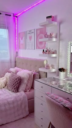 a bedroom with pink lighting and white furniture