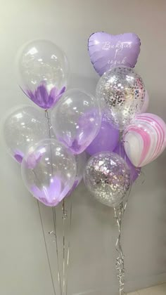 balloons and streamers are arranged in the shape of hearts