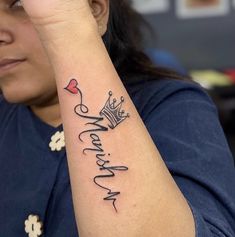 a woman with a tattoo on her arm that says, happy birthday in cursive writing