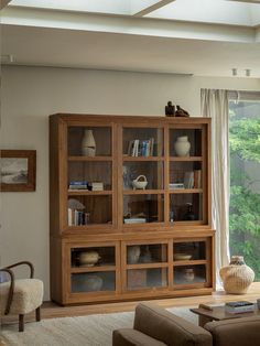 a living room filled with furniture next to a window