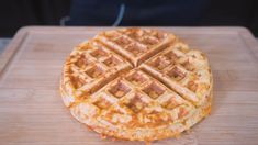 a waffle sitting on top of a wooden cutting board