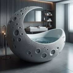 a bathtub shaped like the moon with holes in it's side and inside