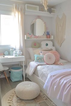 a bedroom with a bed, desk and mirror