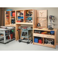 two workbenches with tools in them and one on the table next to it