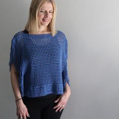 Here's a beautiful denim blue top with the greek key pattern on its bottom. You can wear it over a tank top, a bralette, a swimsuit, a bandeau top, or straight on your skin, on the beach, at the restaurant, at the club. You can pair it with your favourite pair of shorts, a skirt or your jeans. Combinations are infinite!! The denim blue top is ready to ship.  I made this top with a blend of cotton and acrylic yarn in a smoke-free home, more colors will follow.  One size fits most.  Model is 5ft 1 Bohemian Blue Top With Tassels, Blue Bohemian Top With Crochet Trim, Blue Fringe Top For Spring, Beach Blue Tops With Tassels, Blue Beach Tops With Tassels, Blue Tassel Tops For Beach, Blue Fringe Tops For Summer, Blue Tassel Tops For Summer, Blue Cotton Summer Poncho