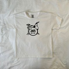 Screen printed on a made to order basis. Handmade with silk screen process, tops may have minor imperfections!⛄️ (I use Gildan Unisex Youth tees for that perfect baby tee look) 100% Cotton ⚠️ -Machine wash cold and hand washing is preferred but not required -please do not iron or bleach -all sales are final White Band Merch Top With Character Print, Arctic Monkeys Tee, Snoopy Clothes, Snoopy Shirt Aesthetic, Peanuts Shirts, Snoopy Tshirts, Vintage Snoopy Shirt, Snoopy Shirt, Snoopy T Shirt