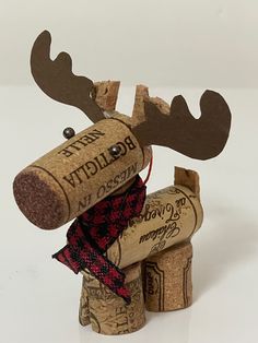 two wine corks are stacked on top of each other to look like a moose