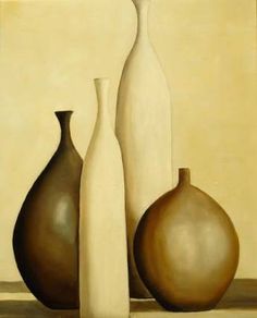 three brown and white vases sitting on top of a table