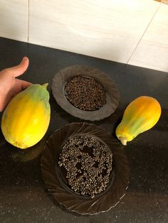 there are three different types of fruit on the counter top, including bananas and papaya