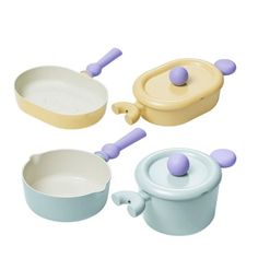 three toy pots and pans are shown on a white background, including one with purple handles