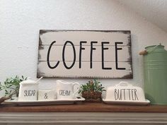 a sign that says coffee on top of a mantle