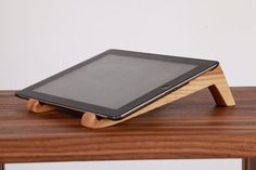 a tablet sitting on top of a wooden table