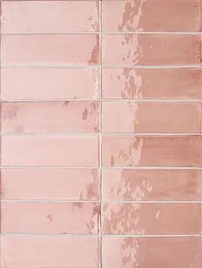 a pink brick wall that has been painted with white paint and is being used as a background