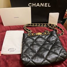 Gorgeous Chanel Small Shopping Bag In Black Lambskin With Gold Hardware. Very Lightly Used- Inside Is Pristine, With Original Plastic Wrap Still On Some Hardware. Minor Scuffs To The Outside Hardware From Normal Wear And Tear. Leather Is In Perfect Condition- No Visible Signs Of Use On Leather. Worn A Handful Of Times By My Mom But She Has Other Purses She Uses More. I Cross Post On Other Platforms Too, Sometimes For Less- Find Me There. High-end Black Shoulder Bag For Everyday Luxury, Mom Purse, Mom Purses, Plastic Wrap, Black Quilt, Chanel Bags, Chanel Black, Chanel Bag, Gold Hardware