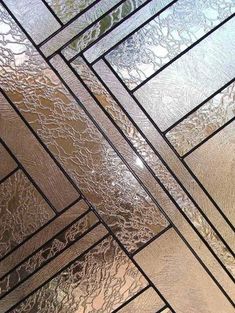 the ceiling is made up of many different types of glass and silver foiled material