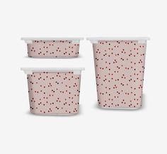 three plastic containers with polka dots on them