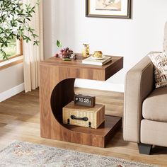 a living room scene with focus on the end table and an alarm clock in the corner