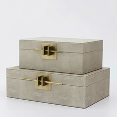 two concrete boxes with gold handles on white background