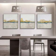 three paintings hanging on the wall above a dining room table with chairs and a couch