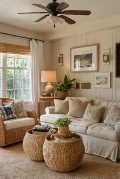 a living room filled with furniture and a ceiling fan in the middle of it's walls