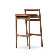 a wooden stool with a leather seat and back rest on an isolated white background,