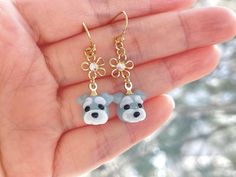 These Schnauzer dog earrings are cute and dainty, which is a perfect gift for kids, friends and dog mom.  It is made of the following: 🔹 Schnauzer (Size: H10 x W12 x D12mm) : It is handmade glass beads. Each bead is unique so there is a slightly different from bead to bead. 🔹 Flower: gold / silver plated over brass with glass crystal 🔹 Earring hooks: gold / silver plated over brass   🔹 Drop length: 36mm approx. 💛 NECKLACE 💛 https://www.etsy.com/listing/1414624631 【PLEASE NOTE THE FOLLOWING Clay Dog Earrings, Pet Earrings, Dog Earrings Clay, Polymer Clay Schnauzer, Schnauzer Gifts, Bone Earrings, Elephant Jewelry, Dog Earrings, Dog Crafts