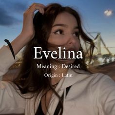 a woman with long hair standing in front of a cityscape and the words evellina meaning desired origin