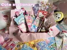 the cute stationery box is packed with various items and has hello kitty stickers on it