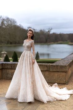 a woman in a wedding dress posing for a photo