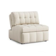 a white couch sitting on top of a white floor