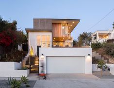 a modern house with stairs leading up to it