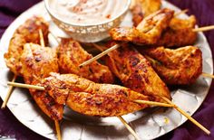 chicken skewers with toothpicks and dipping sauce