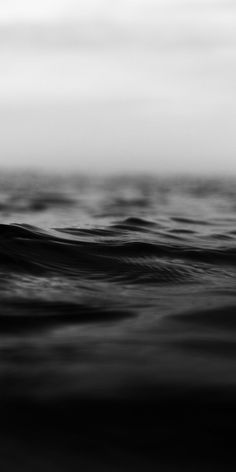 black and white photograph of waves in the ocean