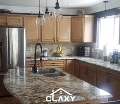 a kitchen with granite counter tops and wooden cabinets