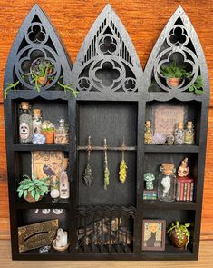 an old bookcase is filled with books and plants