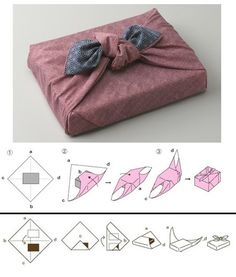 an origami box with a bow on top and instructions to fold it in